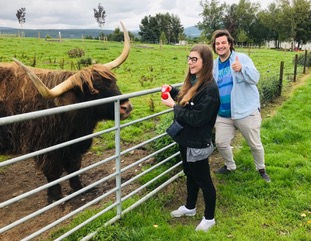 Michael and Tiffany now living in Edinburgh having fun with the Highlans Coos !